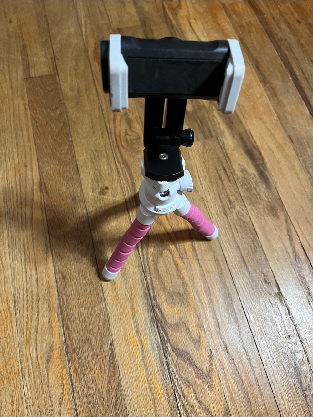 Pink phone tripod with adjustable legs